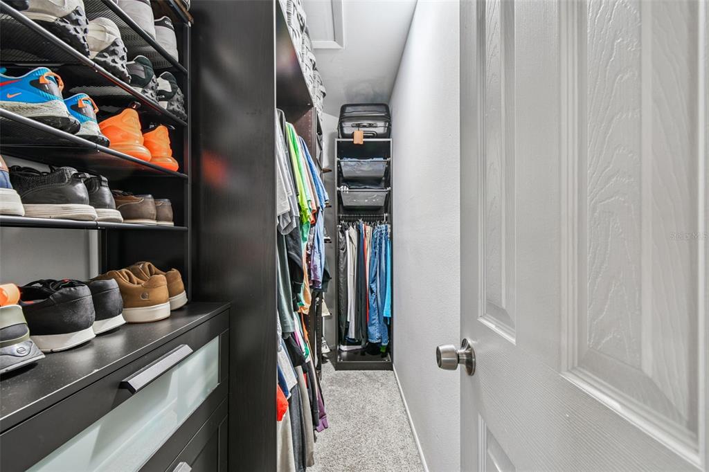 1729 Lakecrest Avenue Brandon, FL 33510 - Photo 22 of 51 a view of walk in closet with clothes and shoes