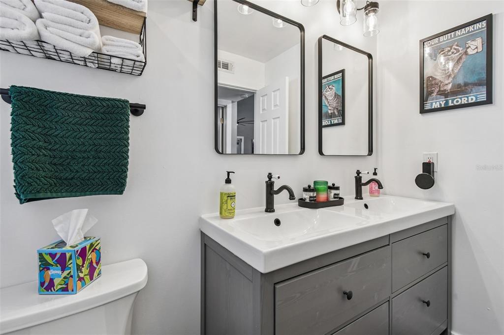 1729 Lakecrest Avenue Brandon, FL 33510 - Photo 31 of 51 a bathroom with a sink mirror and vanity