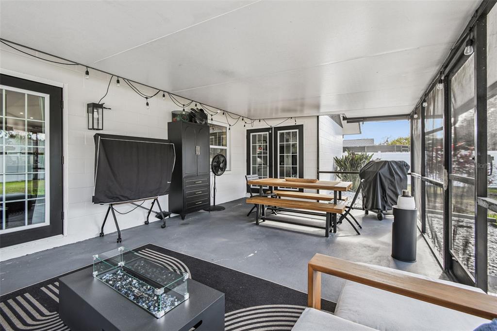 1729 Lakecrest Avenue Brandon, FL 33510 - Photo 34 of 51 a living room with furniture a flat screen tv and a window