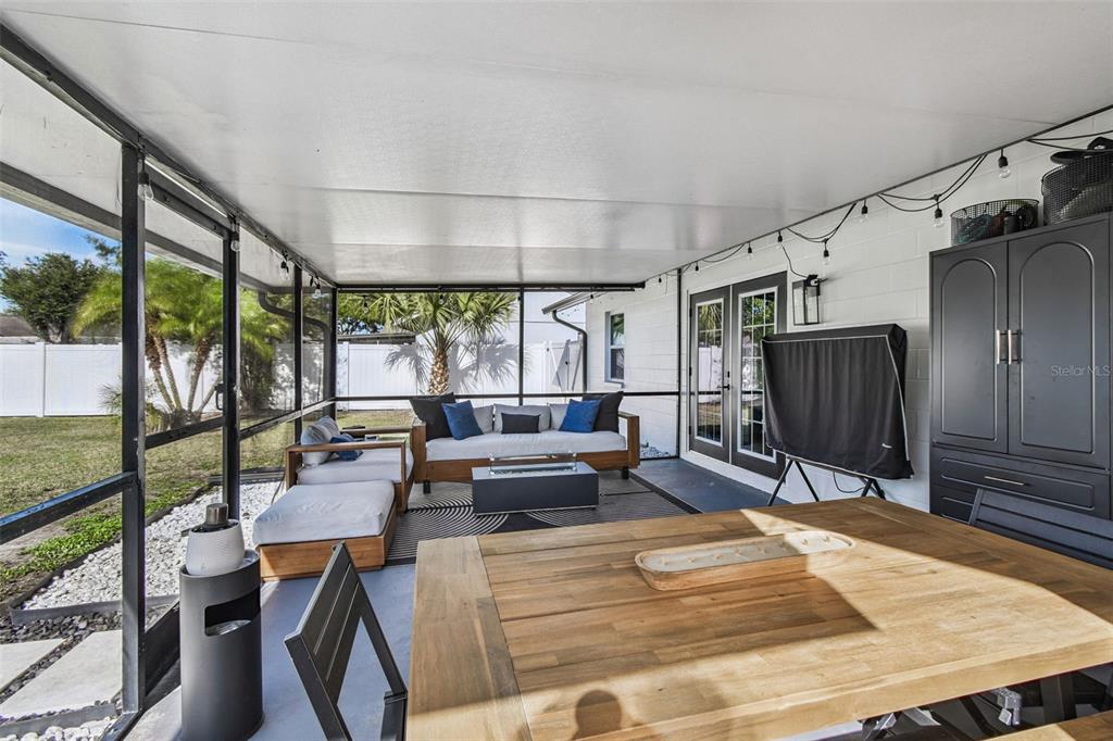 1729 Lakecrest Avenue Brandon, FL 33510 - Photo 36 of 51 a living room with patio furniture and a wooden floor