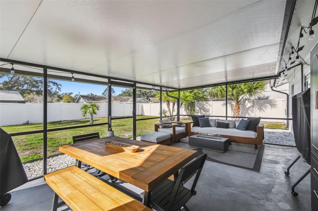 1729 Lakecrest Avenue Brandon, FL 33510 - Photo 37 of 51 a living room with furniture a table and a large window