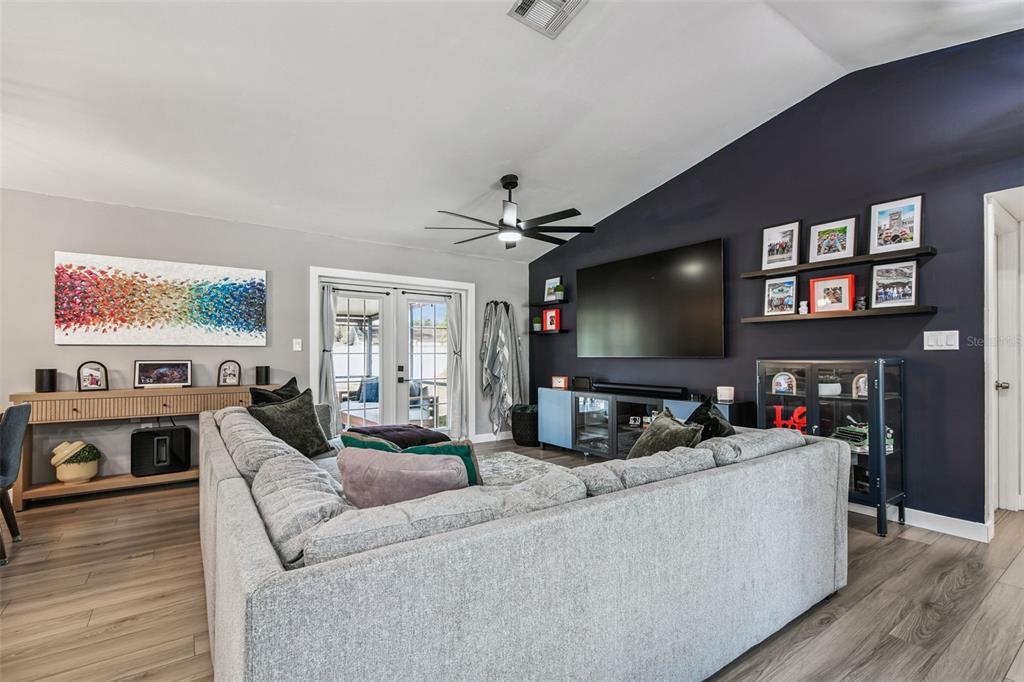 1729 Lakecrest Avenue Brandon, FL 33510 - Photo 7 of 51 a living room with furniture and a flat screen tv