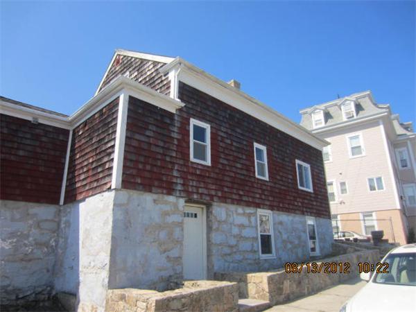 19 Marble Street Fall River, MA 02721 - Photo 1 of 30 a front view of a house with parking
