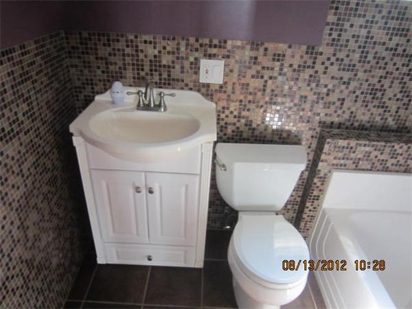 19 Marble Street Fall River, MA 02721 - Photo 18 of 30 a bathroom with a toilet and a sink