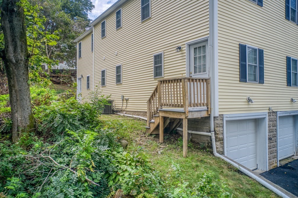 11 Spring Road, Unit A Arlington, MA 02476 - Photo 20 of 20 a backyard of a house with table and chairs