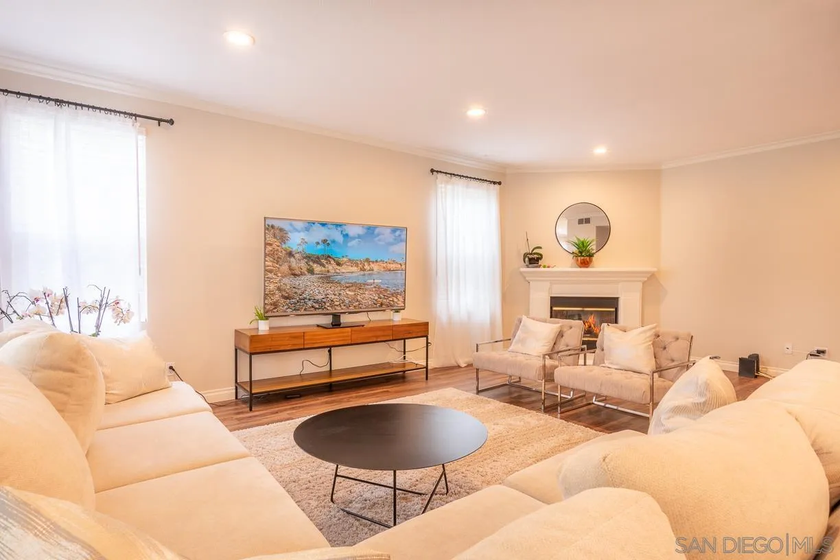 2435 Ridgegate Row La Jolla, CA 92037 - Photo 12 of 30 a living room with furniture and a large window