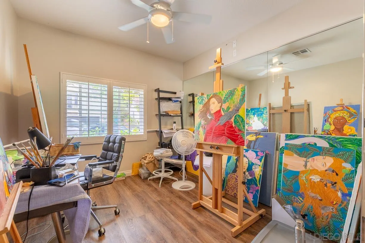 2435 Ridgegate Row La Jolla, CA 92037 - Photo 22 of 30 a very nice looking room with many windows and furniture