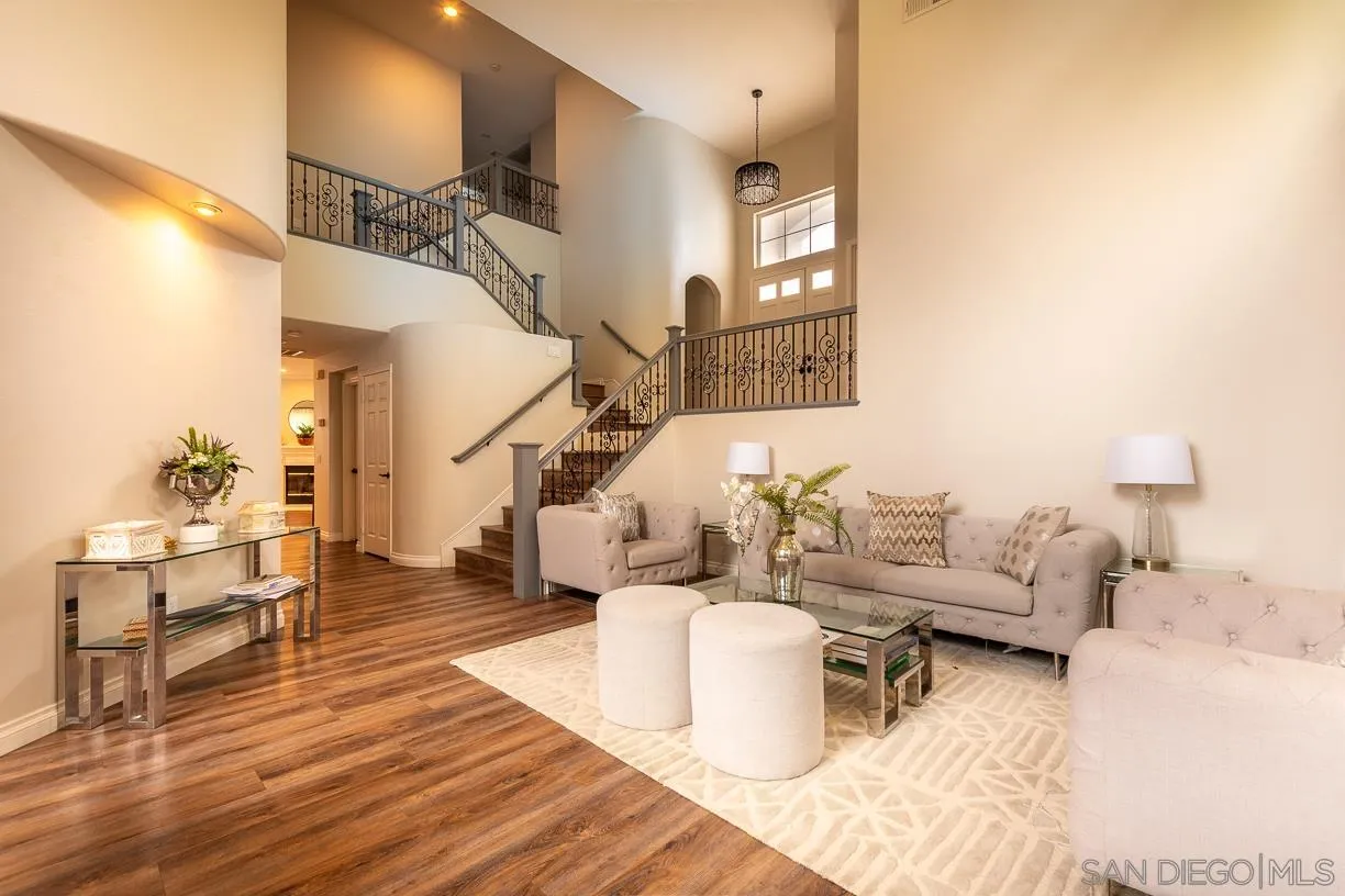 2435 Ridgegate Row La Jolla, CA 92037 - Photo 4 of 30 a living room with furniture and wooden floor