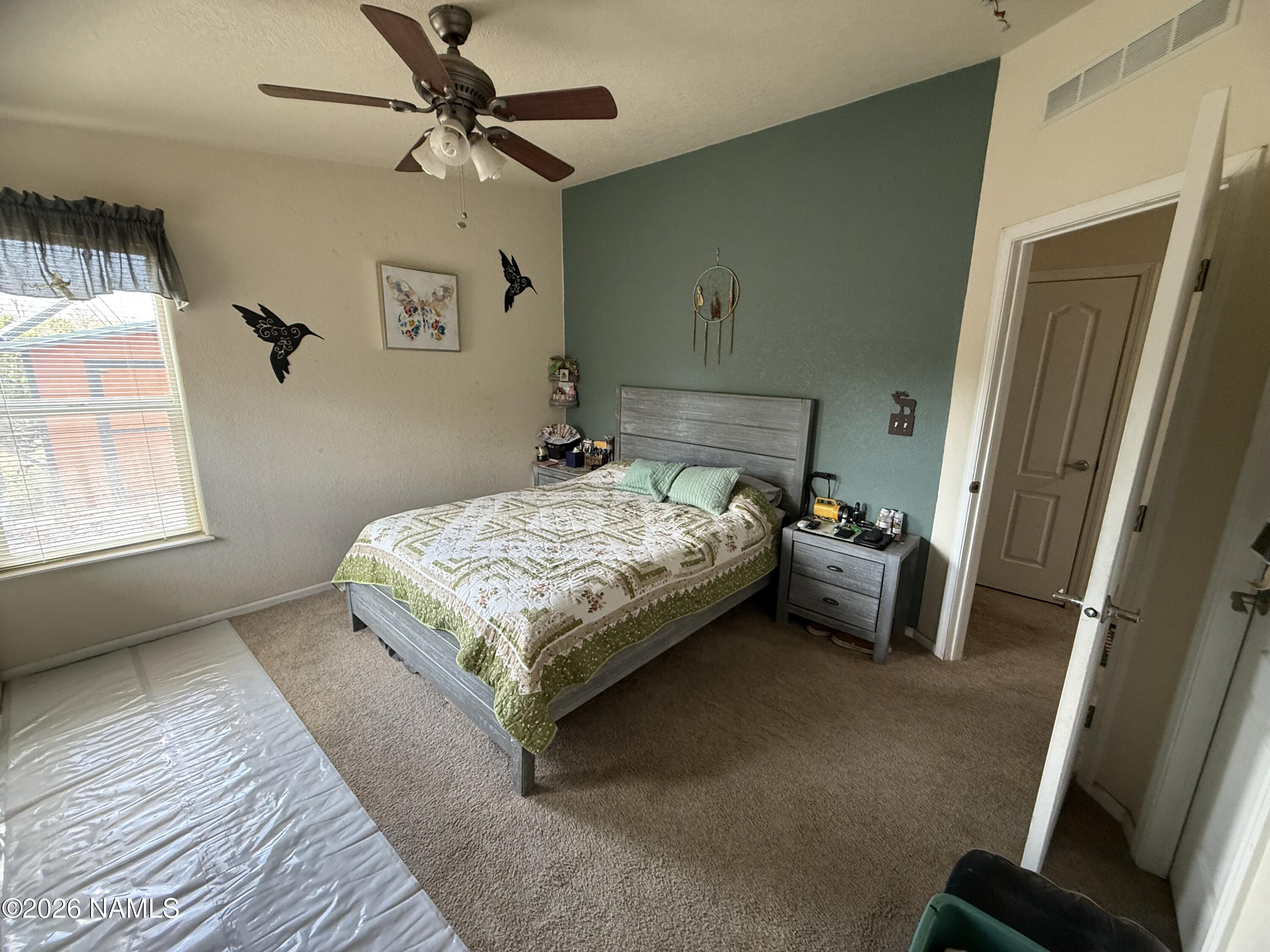 1431 East Cedar Road Williams, AZ 86046 - Photo 30 of 51 a bedroom with a bed and a window