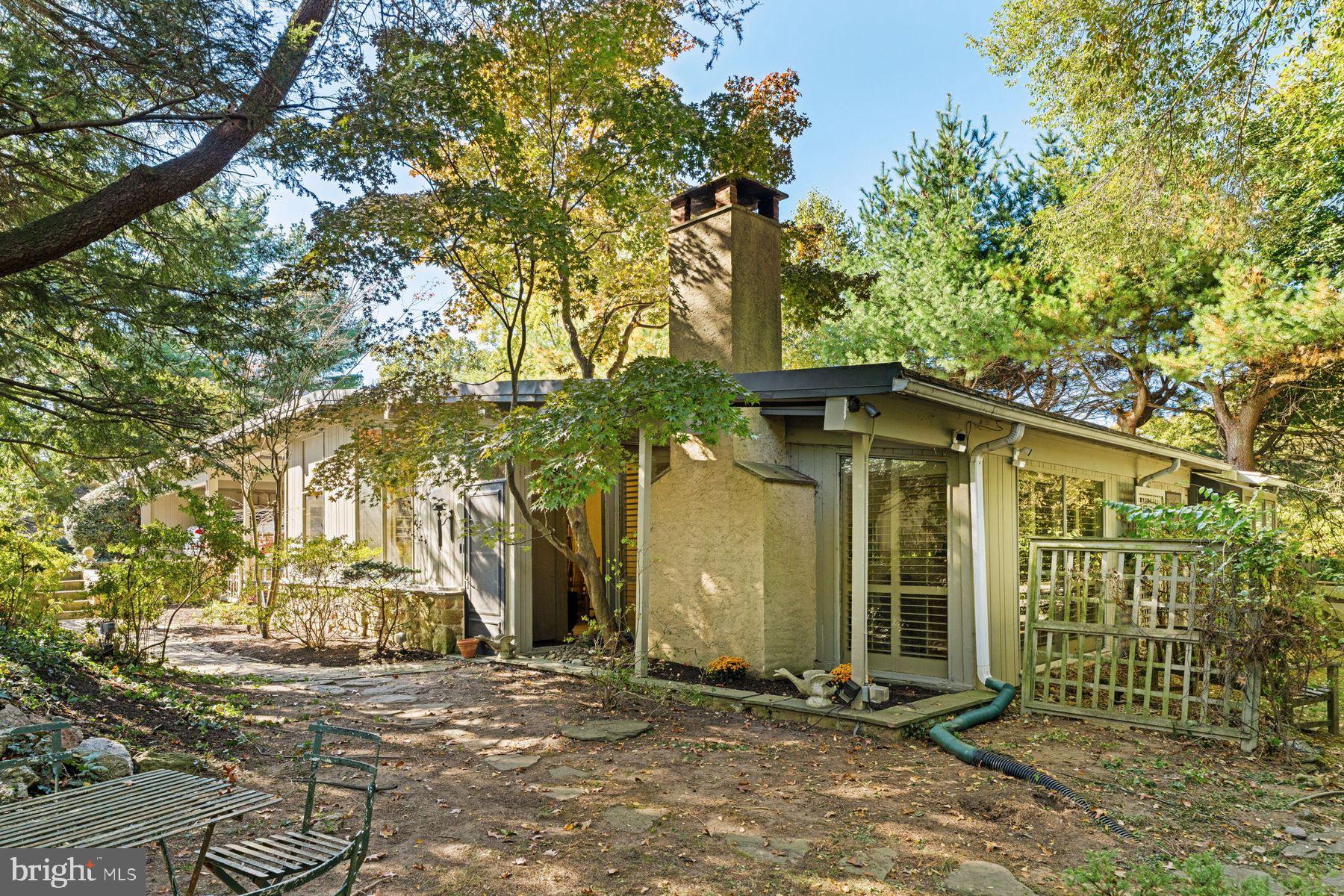 Charming home nestled among lush greenery.