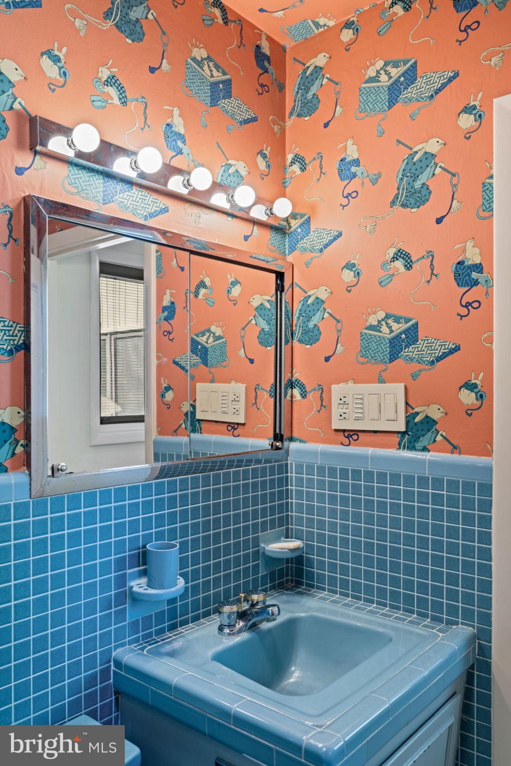 809 Church Road Wyncote, PA 19095 - Photo 14 of 20 Vibrant retro bathroom with playful wallpaper.