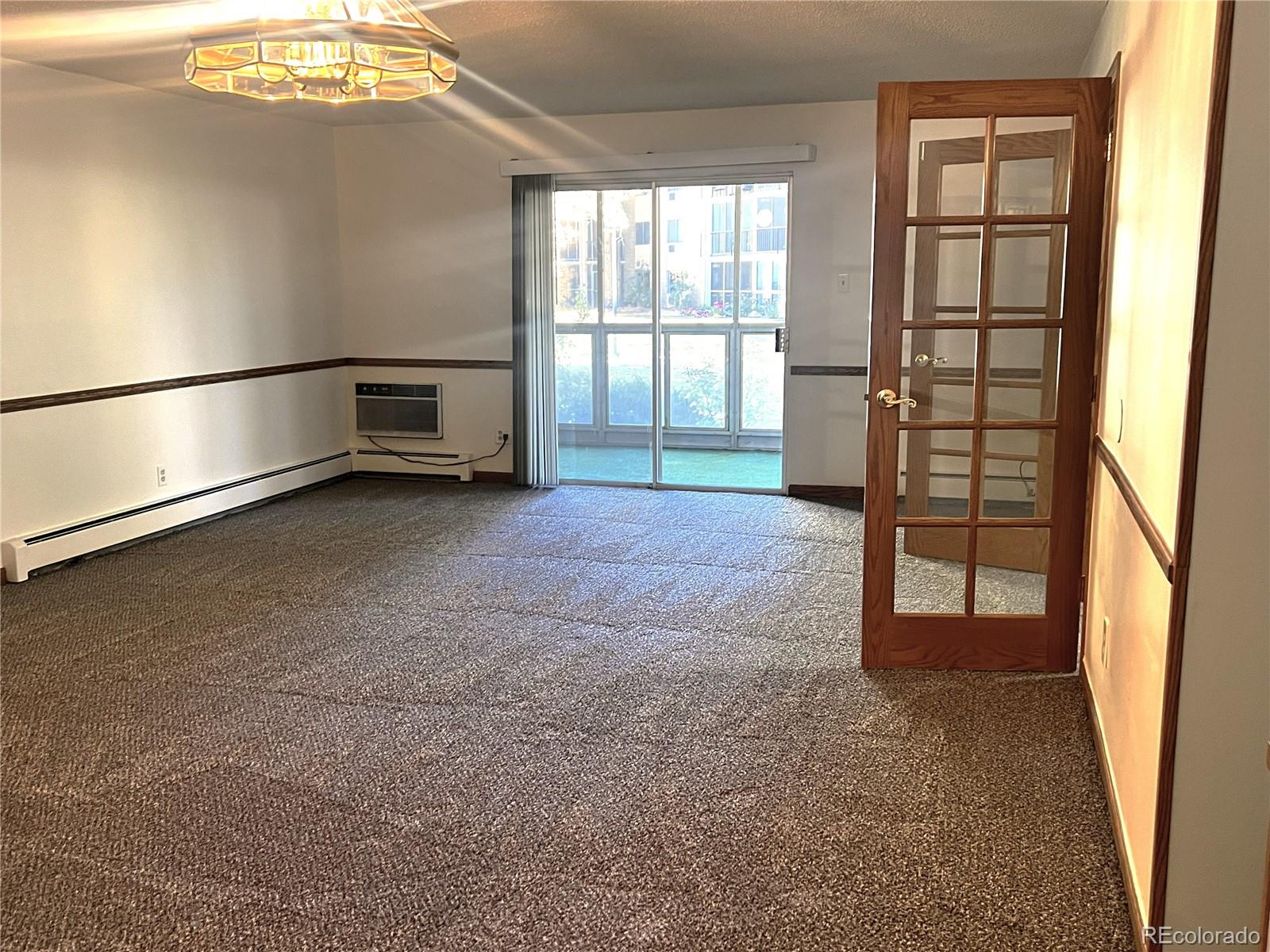 3082 South Wheeling Way, Unit 104 Aurora, CO 80014 - Photo 2 of 27 an empty room with windows