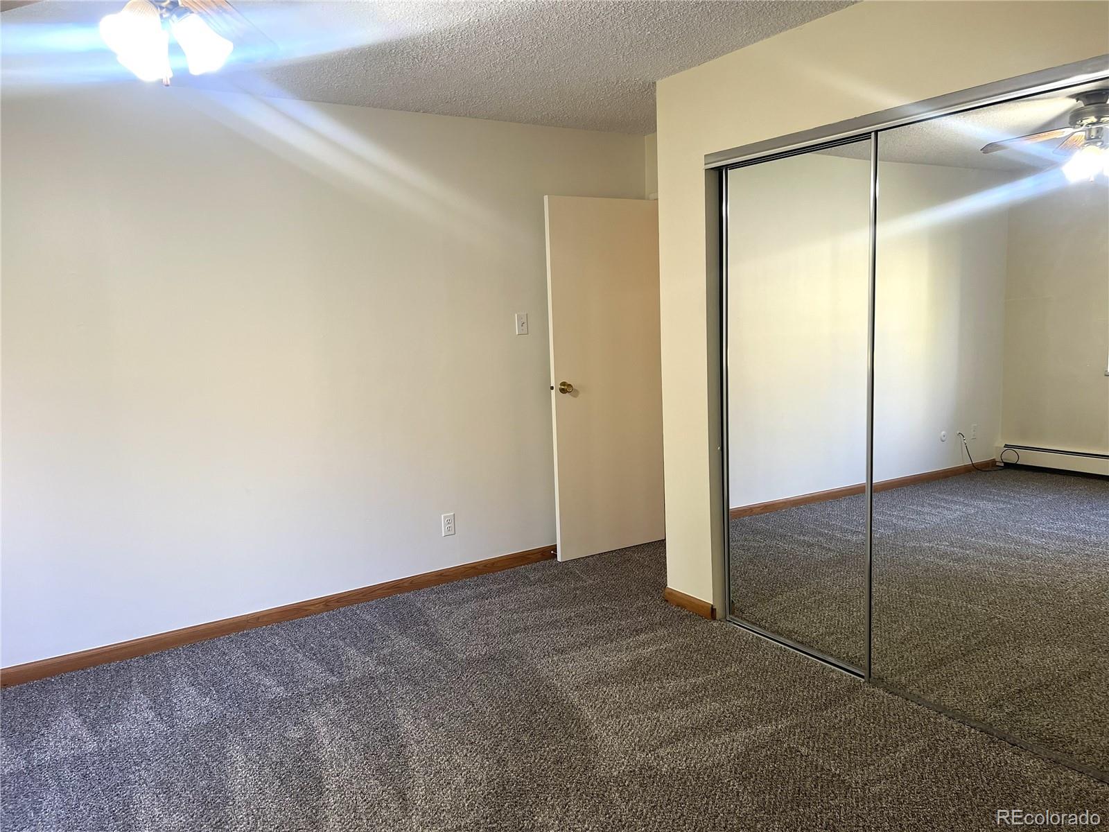 3082 South Wheeling Way, Unit 104 Aurora, CO 80014 - Photo 4 of 27 a view of an empty room