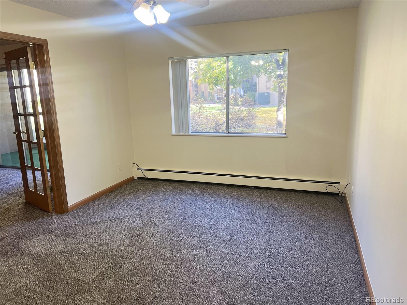 3082 South Wheeling Way, Unit 104 Aurora, CO 80014 - Photo 5 of 27 an empty room with a window