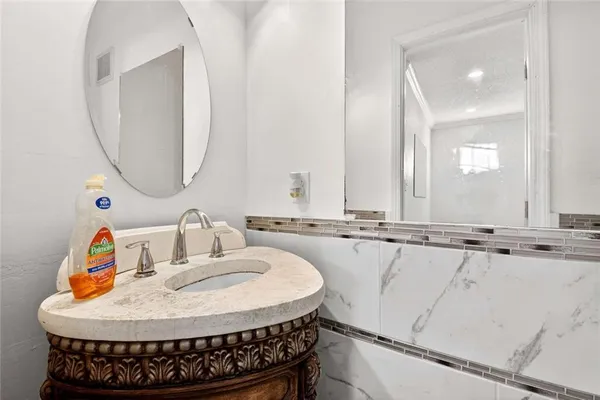 a bathroom with a sink and a mirror
