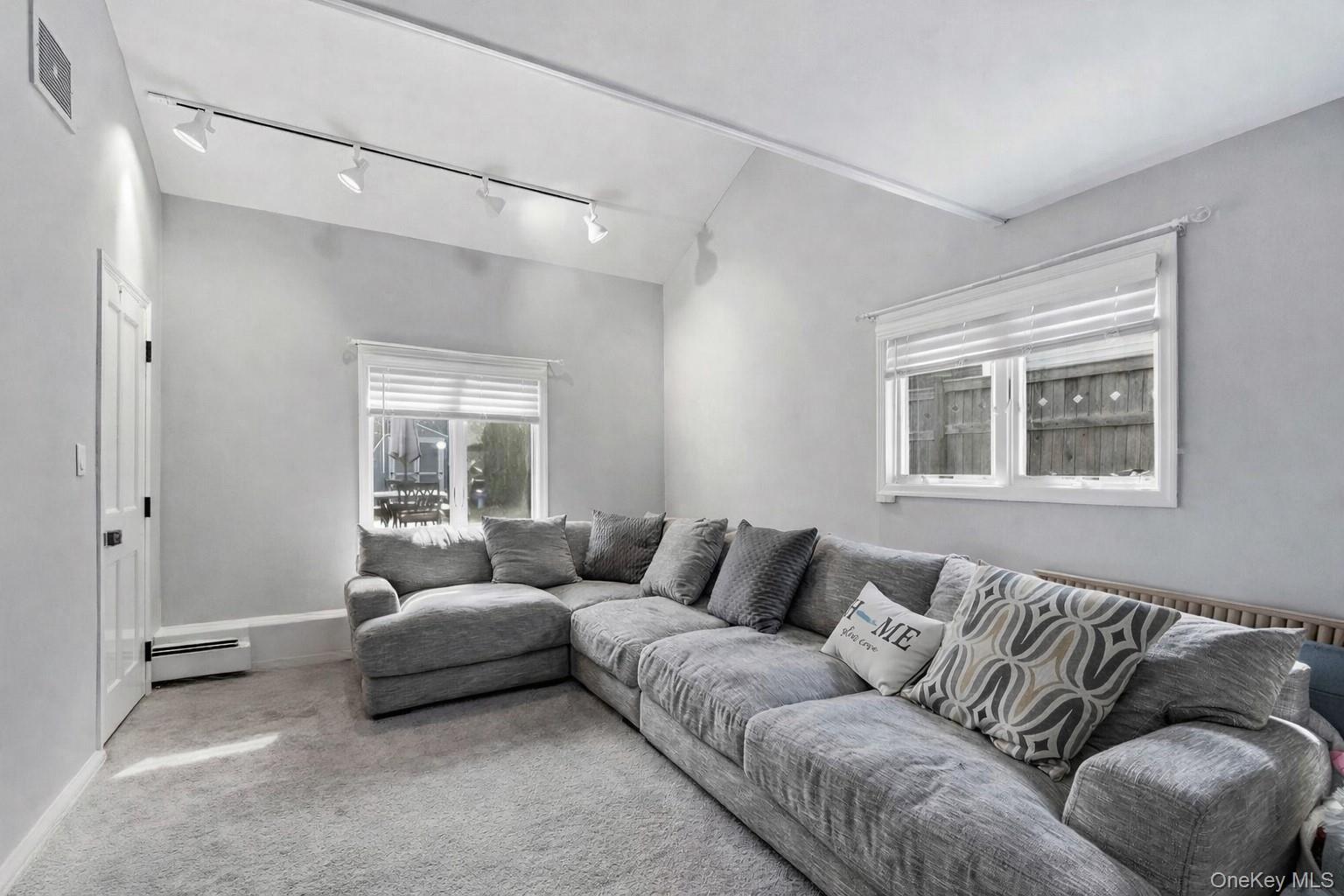 12 Sherman Road Glen Cove, NY 11542 - Photo 15 of 27 a living room with furniture and a window