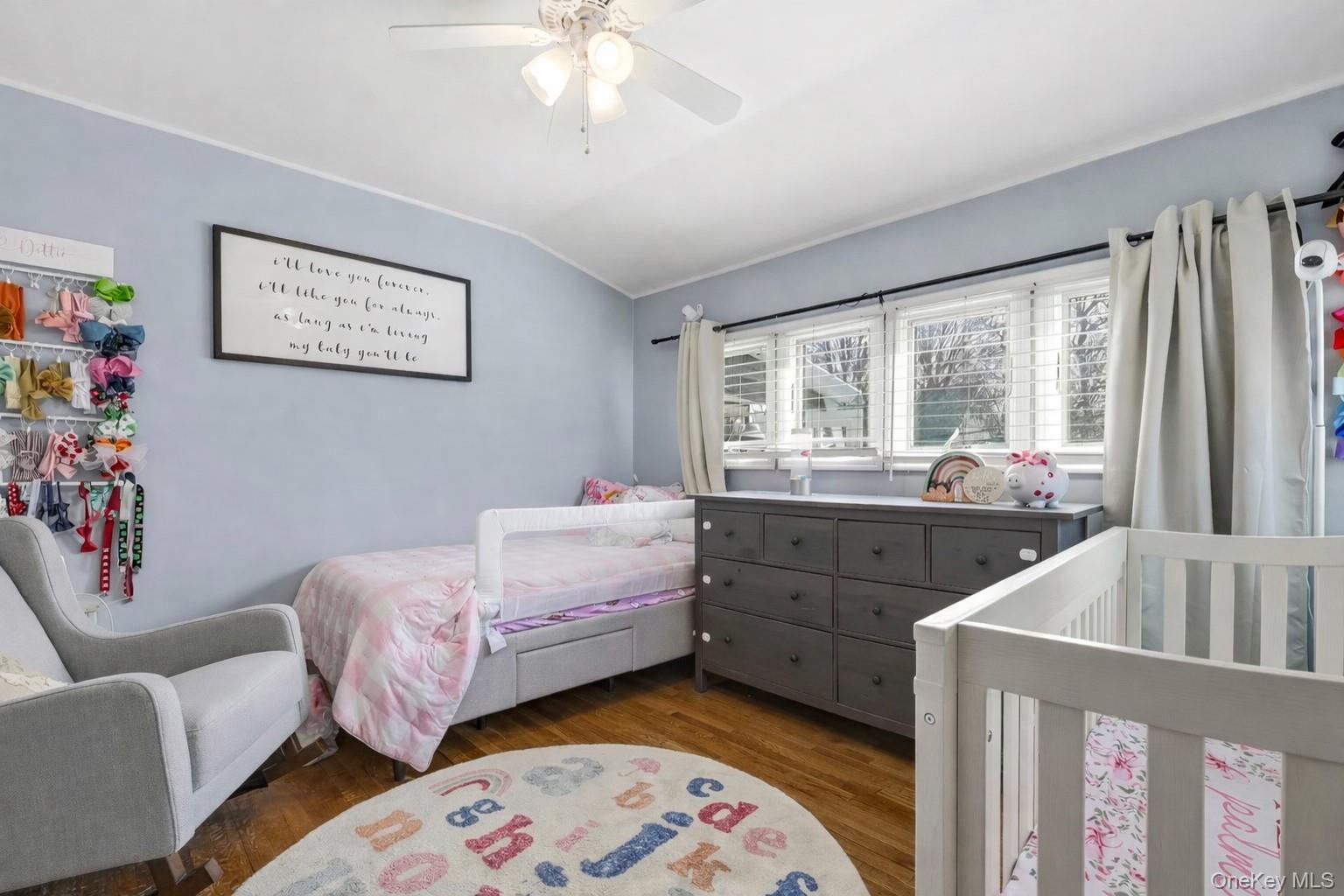 12 Sherman Road Glen Cove, NY 11542 - Photo 16 of 27 a bedroom with furniture and a large window