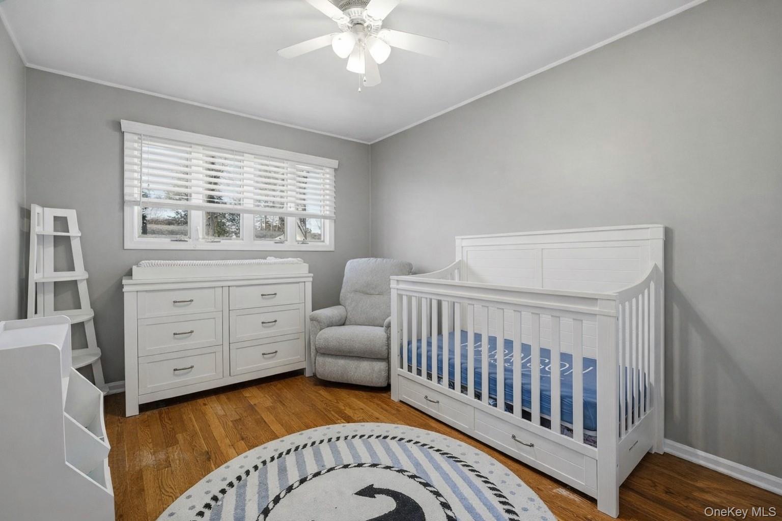 12 Sherman Road Glen Cove, NY 11542 - Photo 17 of 27 a bedroom with furniture and a window