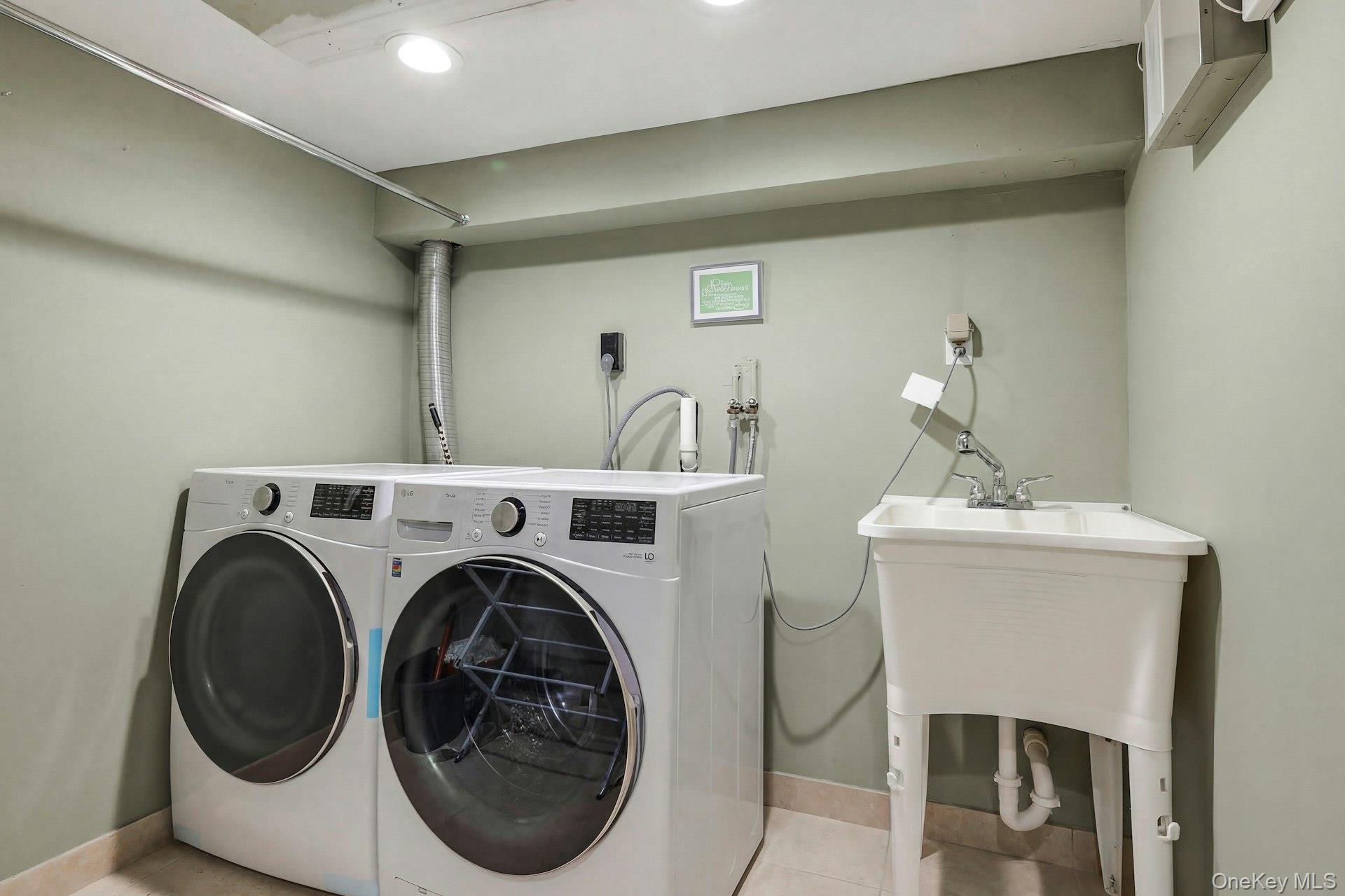 12 Sherman Road Glen Cove, NY 11542 - Photo 19 of 27 a utility room with dryer and washer
