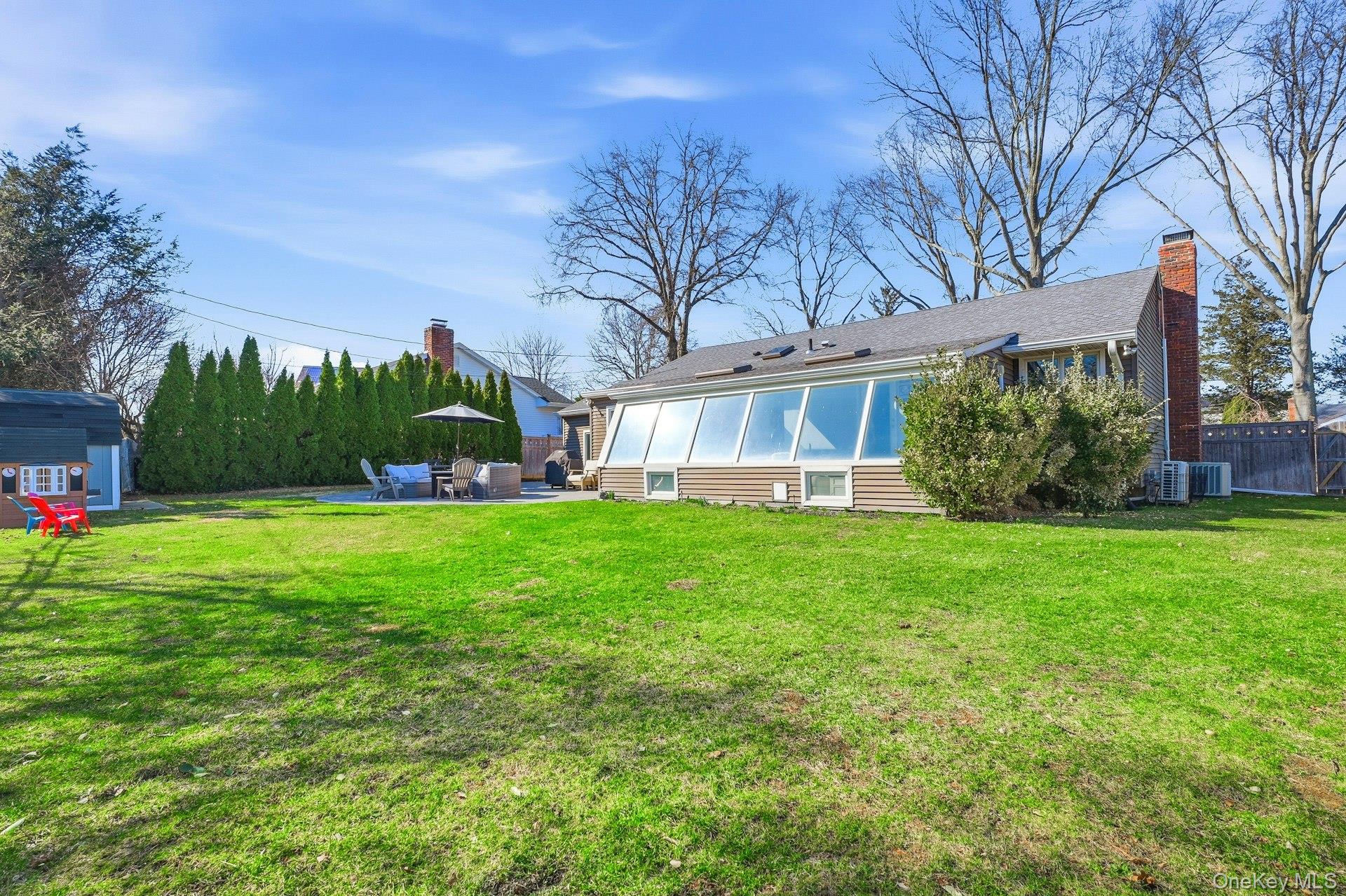 12 Sherman Road Glen Cove, NY 11542 - Photo 2 of 27 a front view of a house with garden