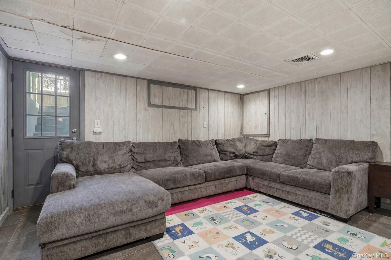 12 Sherman Road Glen Cove, NY 11542 - Photo 21 of 27 a living room with furniture and a couch