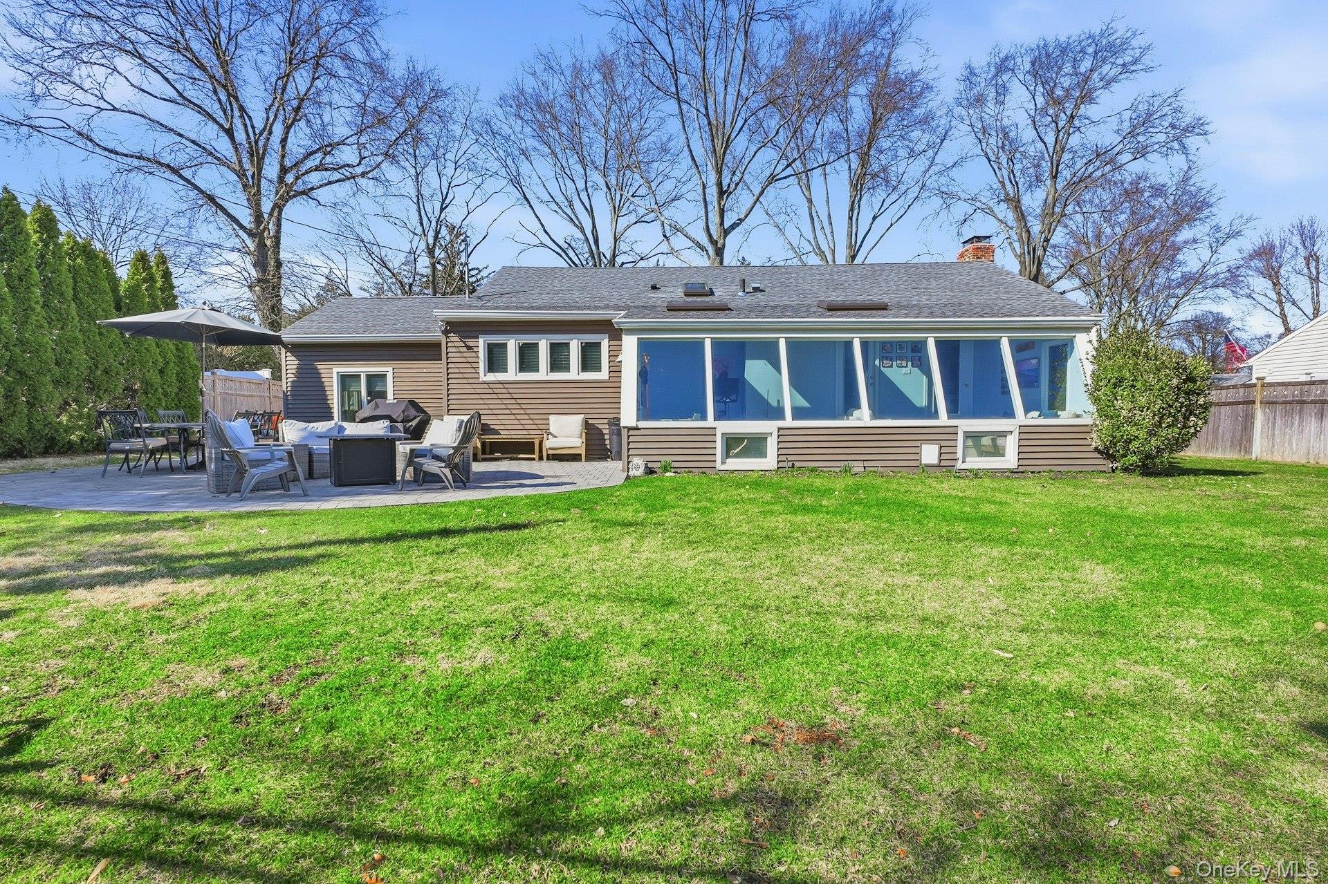 12 Sherman Road Glen Cove, NY 11542 - Photo 26 of 27 front view of a house with a yard