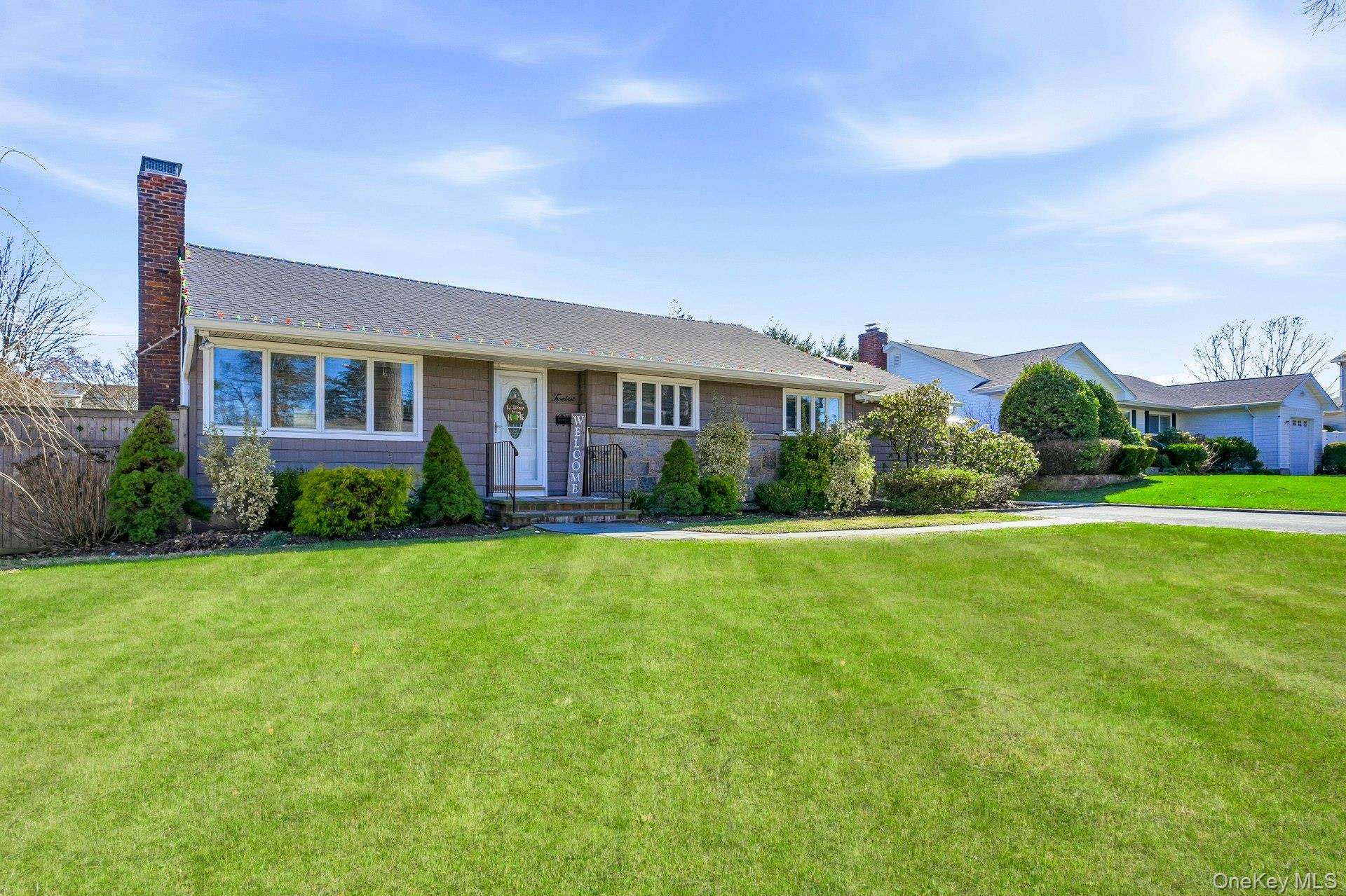 12 Sherman Road Glen Cove, NY 11542 - Photo 27 of 27 a front view of house with yard and green space