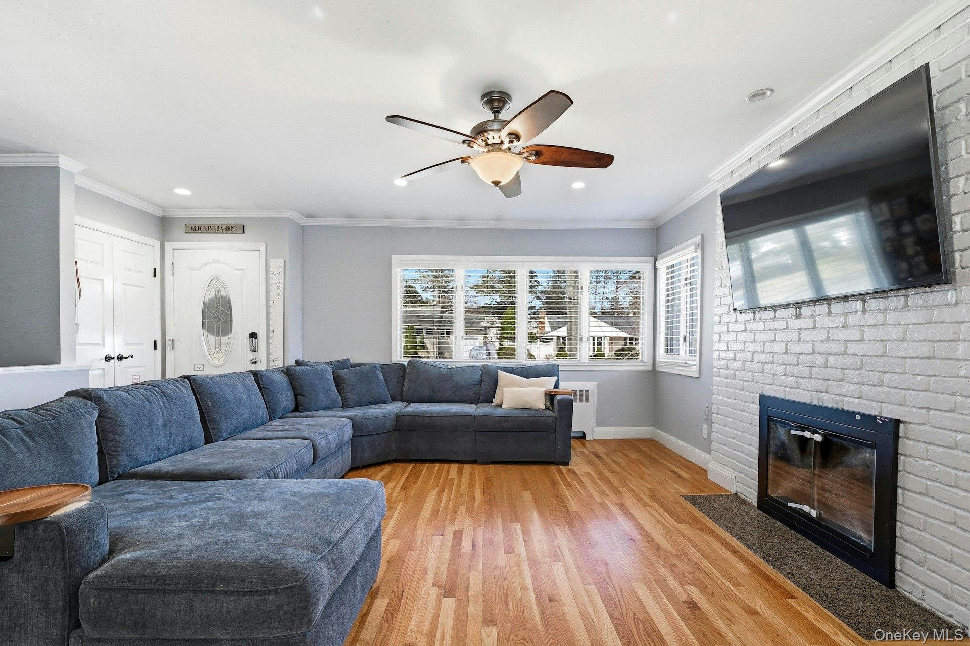 12 Sherman Road Glen Cove, NY 11542 - Photo 4 of 27 a living room with furniture and a fireplace