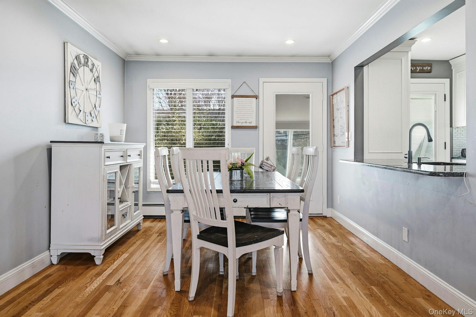 12 Sherman Road Glen Cove, NY 11542 - Photo 6 of 27 a view of a dining room with furniture window and wooden floor