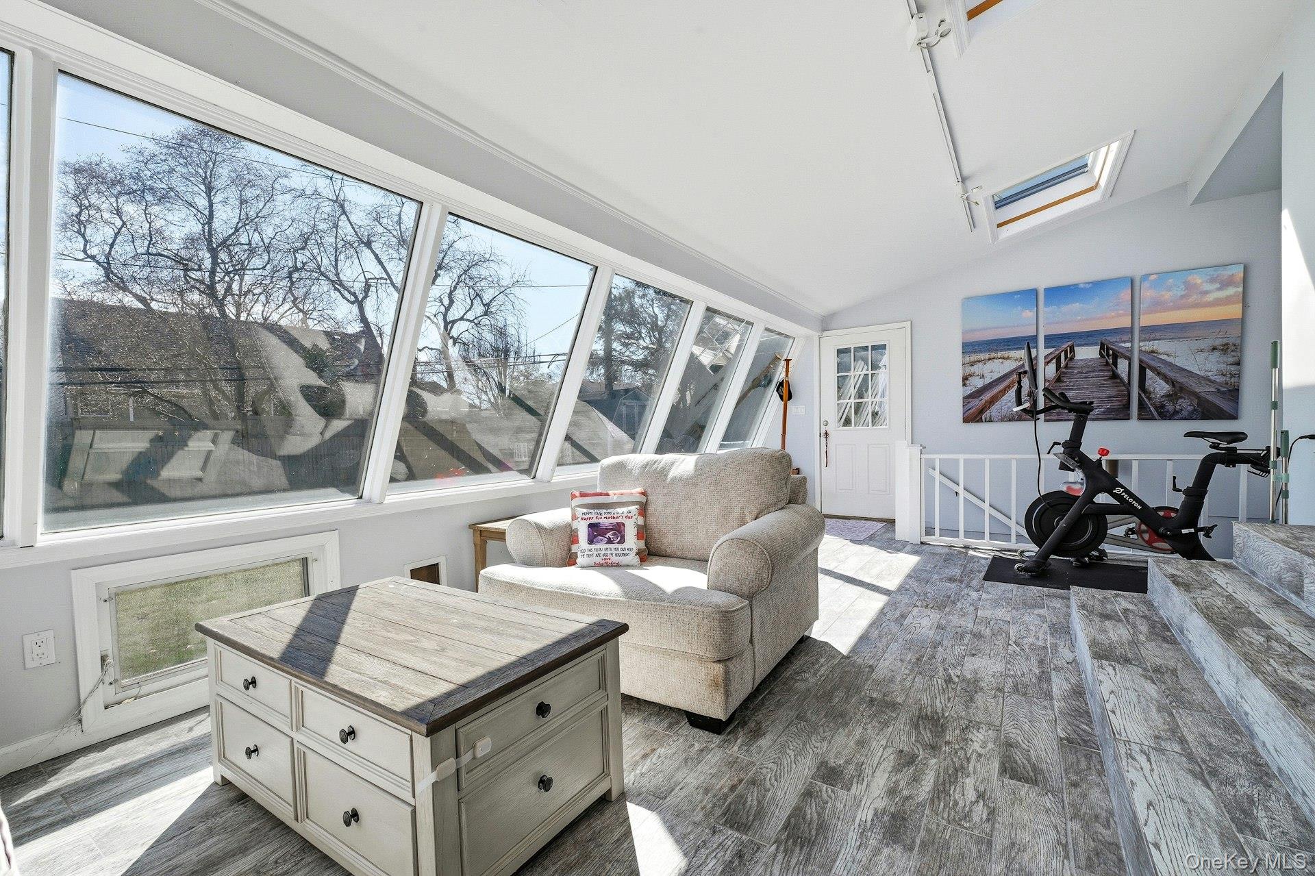 12 Sherman Road Glen Cove, NY 11542 - Photo 10 of 27 a living room with furniture and a floor to ceiling window