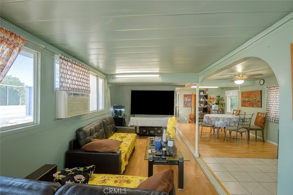 4117 West McFadden Avenue Santa Ana, CA 92704 - Photo 2 of 11 a living room with furniture and a flat screen tv