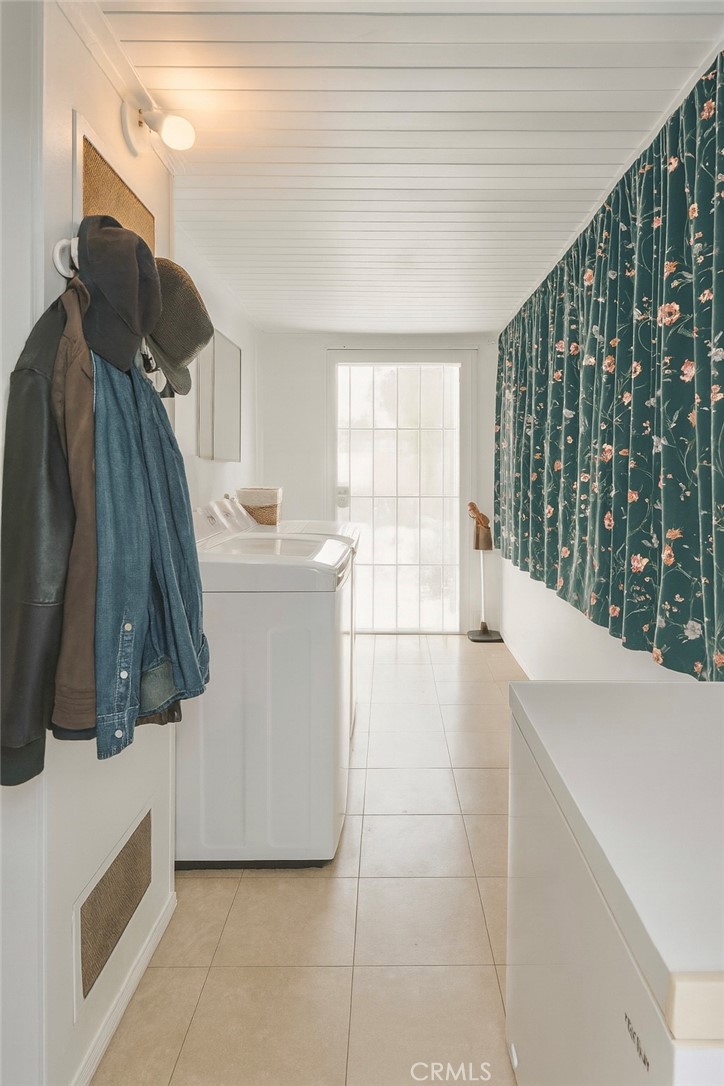 4117 West McFadden Avenue Santa Ana, CA 92704 - Photo 7 of 11 a living room with a couch and a large window