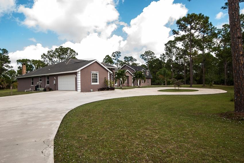 12557 154th Road North Jupiter, FL 33478 - Photo 32 of 38 a view of house with swimming pool and yard
