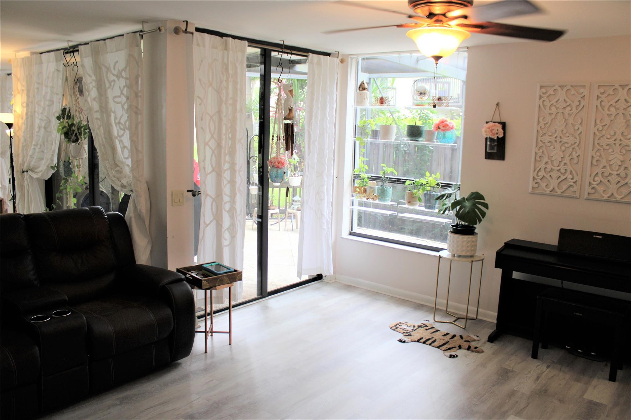 5762 Fox Hollow Drive, Unit G Boca Raton, FL 33486 - Photo 21 of 53 a living room with furniture and a window