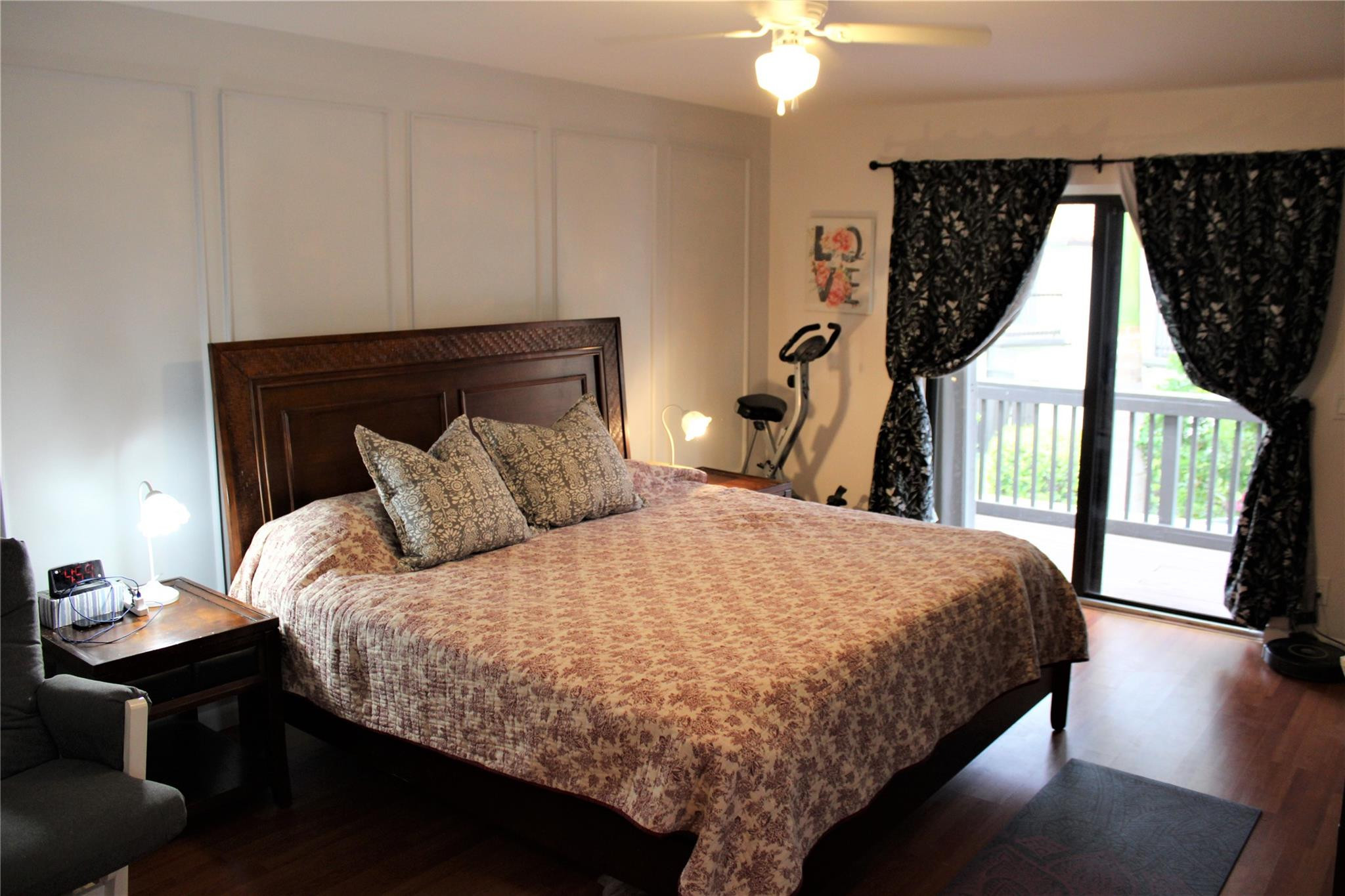 5762 Fox Hollow Drive, Unit G Boca Raton, FL 33486 - Photo 31 of 53 a bed sitting in a bedroom next to a window