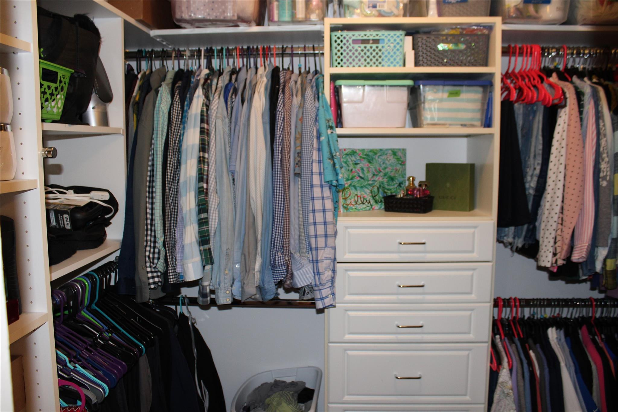 5762 Fox Hollow Drive, Unit G Boca Raton, FL 33486 - Photo 36 of 53 a view of walk in closet with clothes and shoes