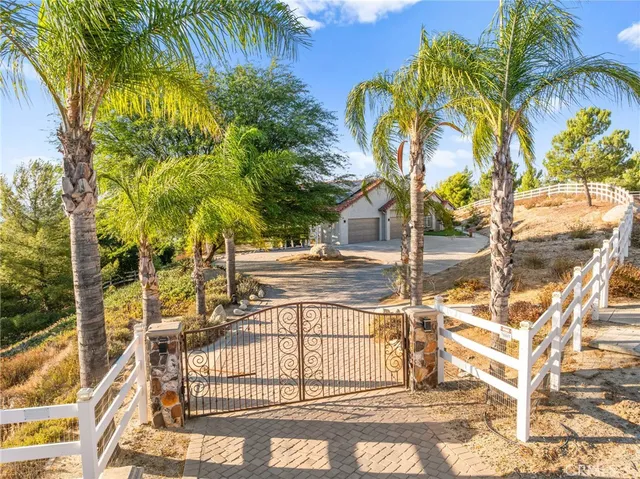 a kitchen with a sink a counter top space and living room