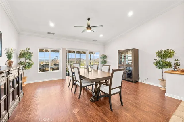 a living room with furniture wooden floor and a rug