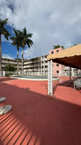 a view of a swimming pool with a garden