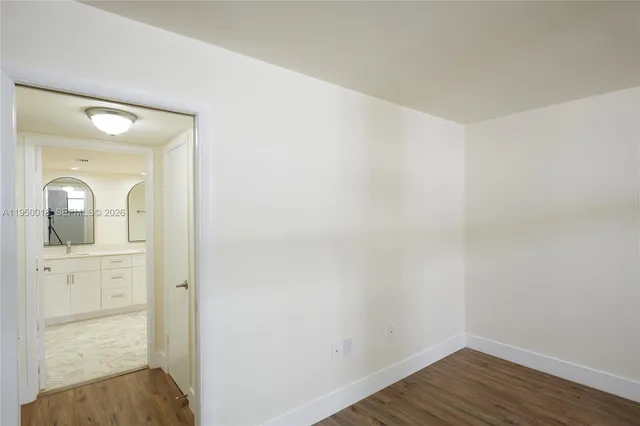 a view of a bathroom from a hallway