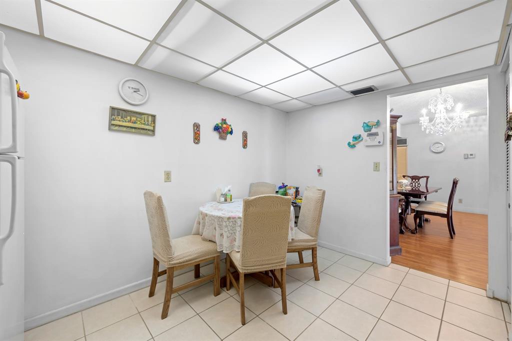 1301 Northeast 7th Street, Unit 113 Hallandale Beach, FL 33009 - Photo 11 of 45 a view of a dining room with furniture