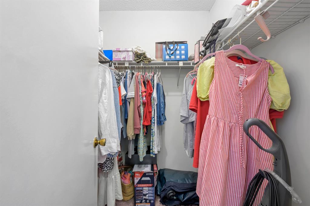 1301 Northeast 7th Street, Unit 113 Hallandale Beach, FL 33009 - Photo 19 of 45 a view of walk in closet with clothes