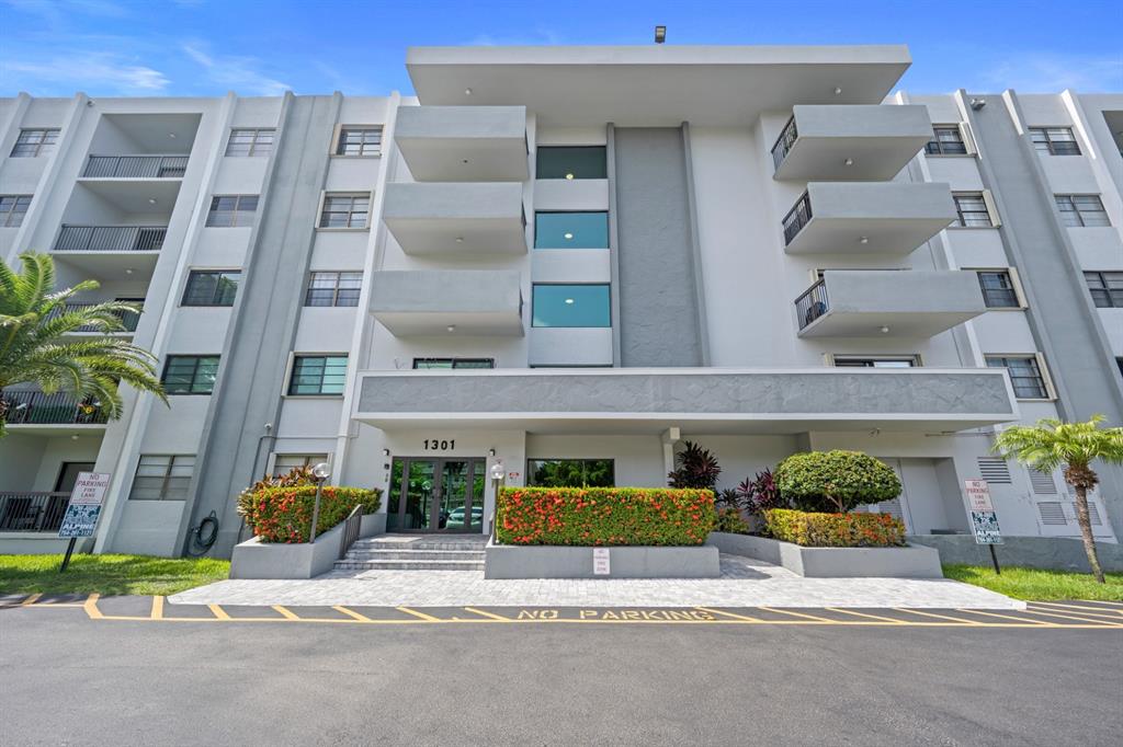 1301 Northeast 7th Street, Unit 113 Hallandale Beach, FL 33009 - Photo 2 of 45 a house with outdoor space