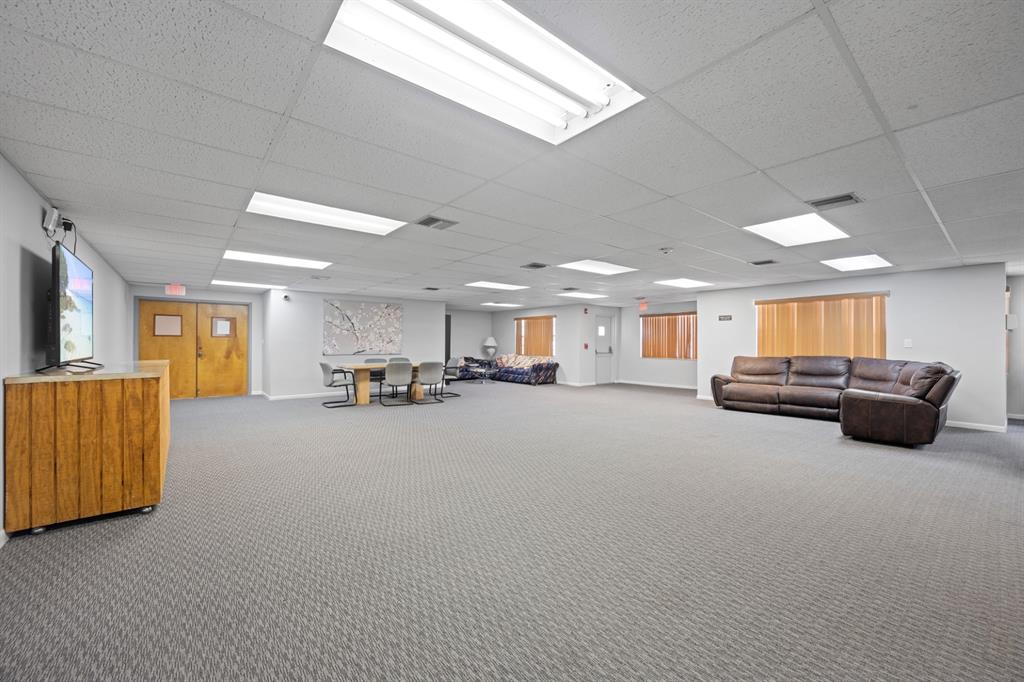 1301 Northeast 7th Street, Unit 113 Hallandale Beach, FL 33009 - Photo 23 of 45 a living room with furniture and a wooden floor