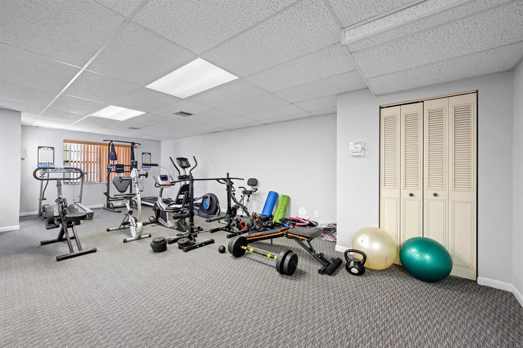 1301 Northeast 7th Street, Unit 113 Hallandale Beach, FL 33009 - Photo 24 of 45 a view of a room with gym equipment