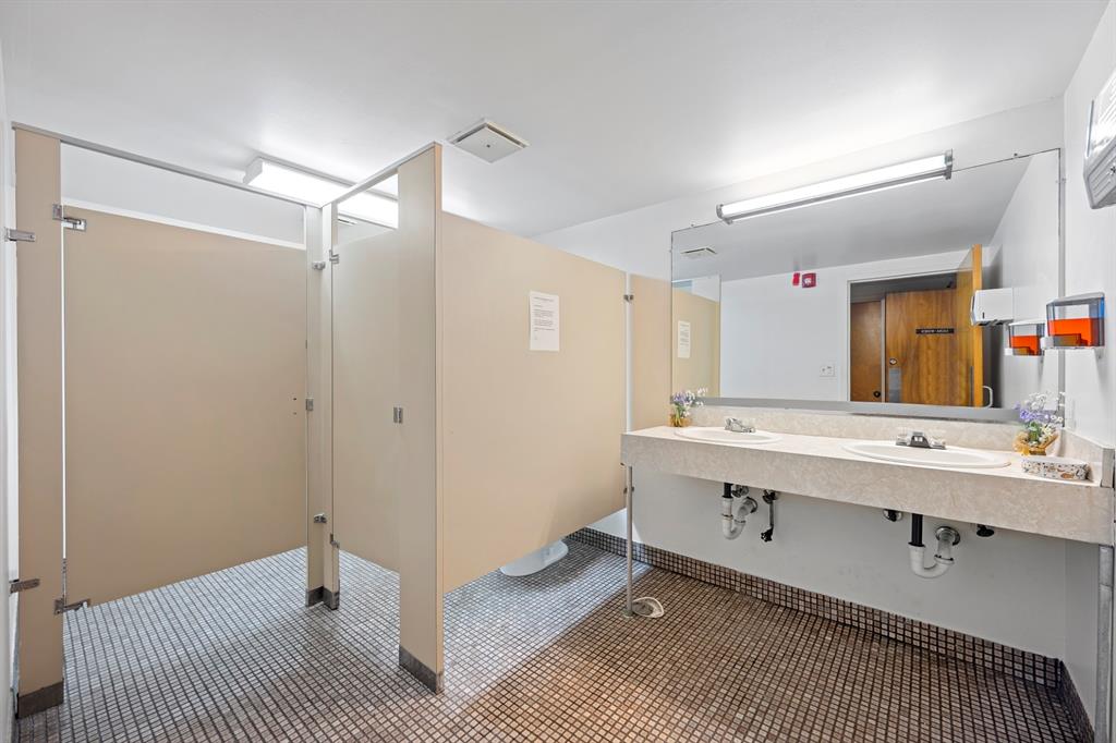 1301 Northeast 7th Street, Unit 113 Hallandale Beach, FL 33009 - Photo 25 of 45 a bathroom with a sink and mirror