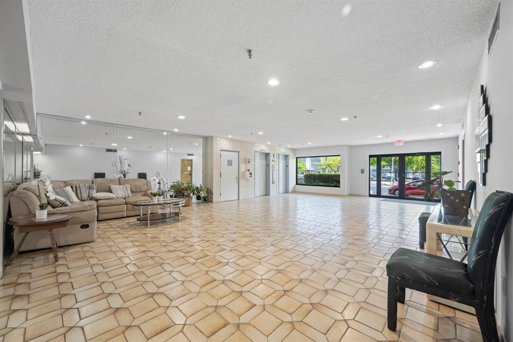1301 Northeast 7th Street, Unit 113 Hallandale Beach, FL 33009 - Photo 28 of 45 a living room with furniture