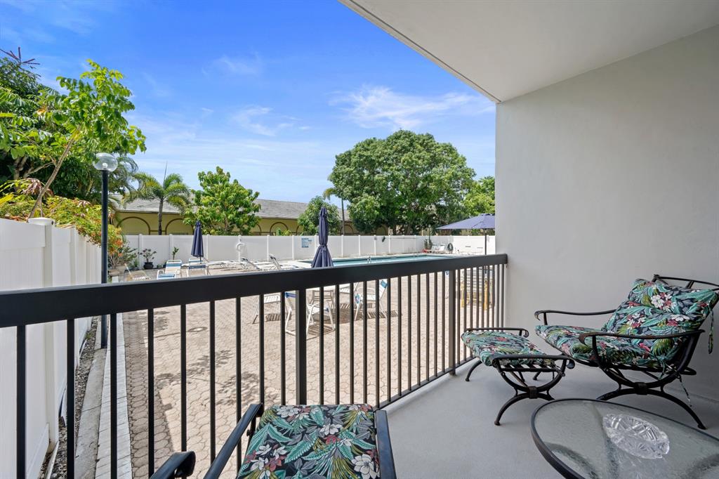 1301 Northeast 7th Street, Unit 113 Hallandale Beach, FL 33009 - Photo 4 of 45 a view of balcony with furniture