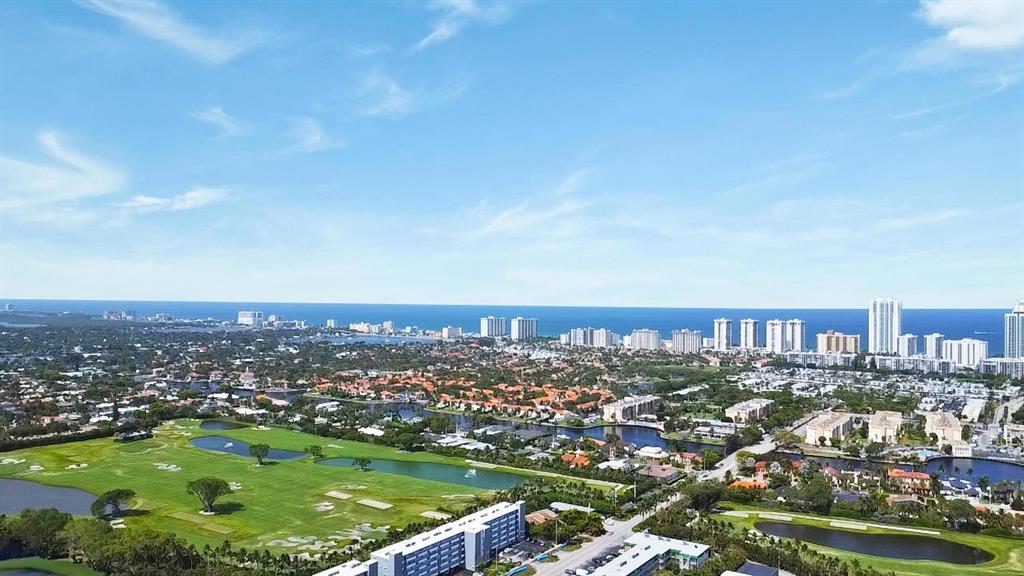 1301 Northeast 7th Street, Unit 113 Hallandale Beach, FL 33009 - Photo 44 of 45 an aerial view of residential houses with city view