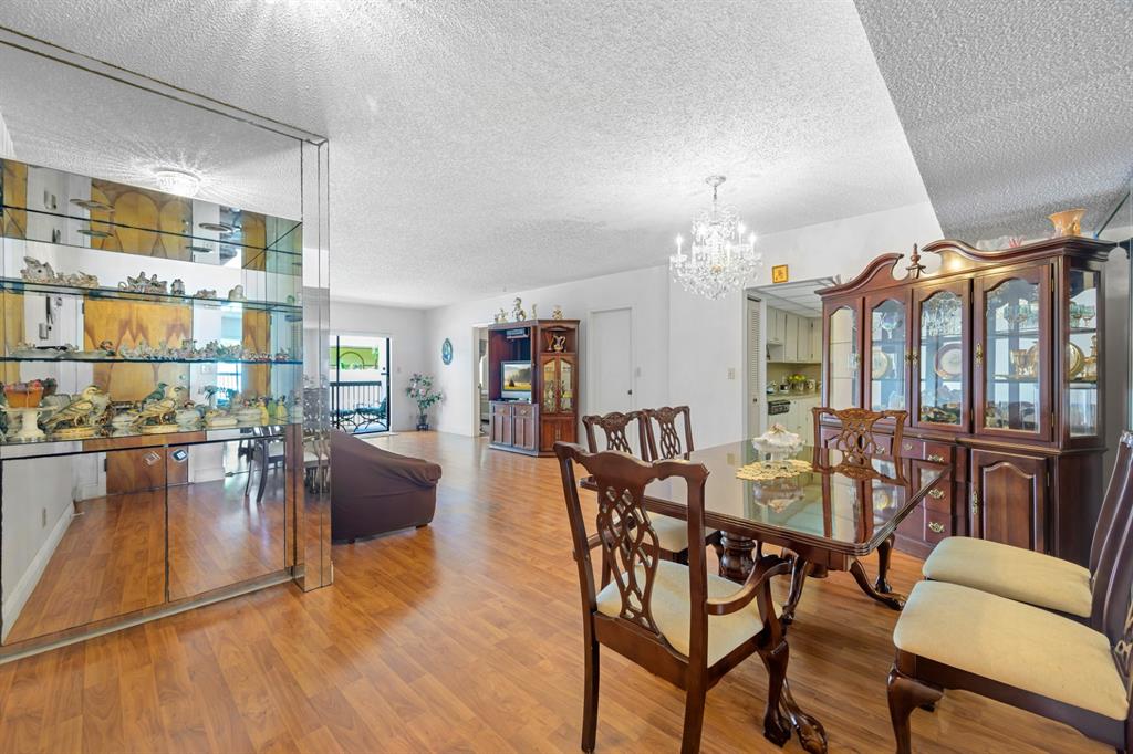1301 Northeast 7th Street, Unit 113 Hallandale Beach, FL 33009 - Photo 9 of 45 a view of a dining room with furniture window and outside view